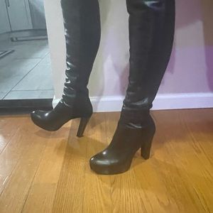 Never worn. Black pull-on with stretchback leather platform 4 inch heel. Size 9M